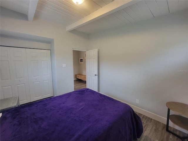 305 Elsie Ave, Daytona Beach, FL 32117 - bedroom featuring wooden ceiling, a closet, beam ceiling, and wood finished floors
