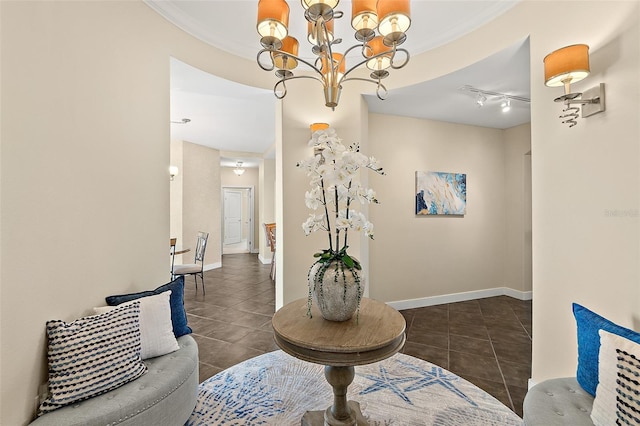 interior space featuring ornamental molding, tile patterned flooring, and baseboards