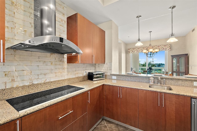 kitchen featuring tasteful backsplash, a sink, light stone countertops, wall chimney exhaust hood, and black electric cooktop