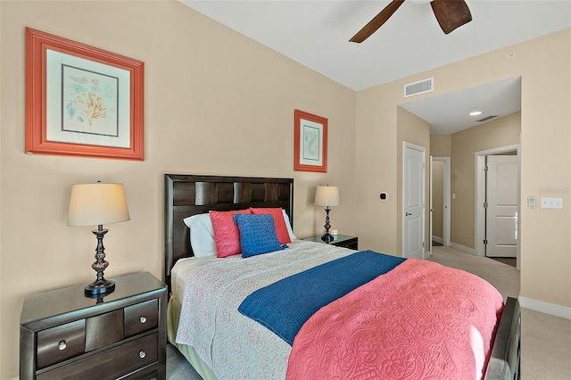 carpeted bedroom with a ceiling fan, visible vents, and baseboards