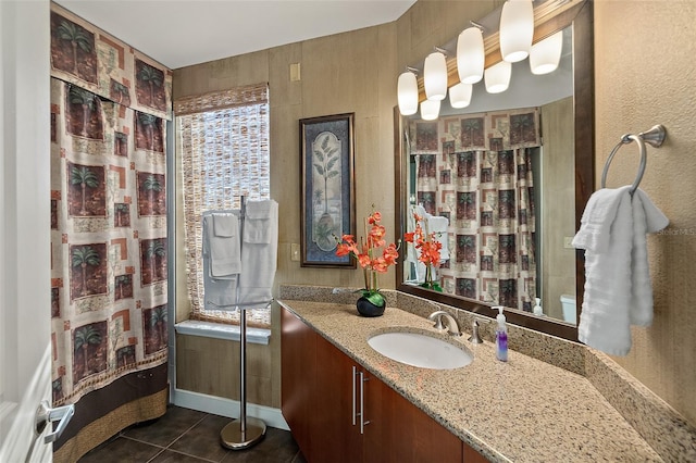 full bath with baseboards, tile patterned flooring, vanity, and a shower with curtain