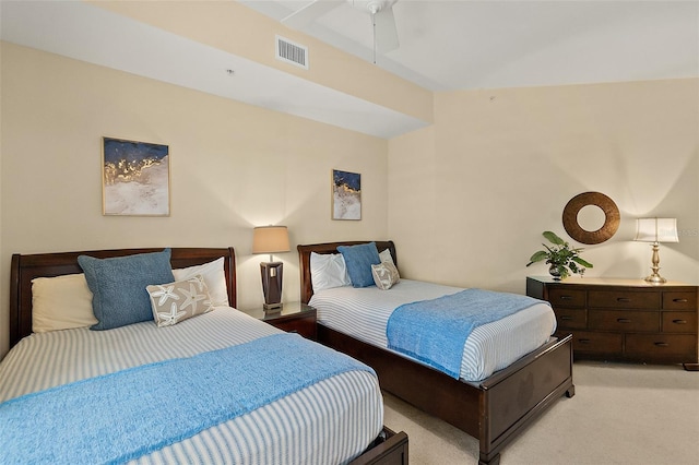 bedroom with a ceiling fan, visible vents, and light carpet