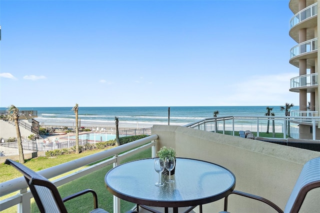 balcony featuring a water view