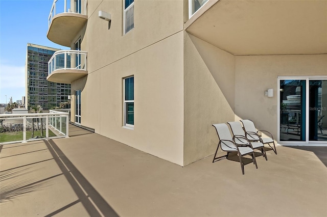 view of patio with a balcony