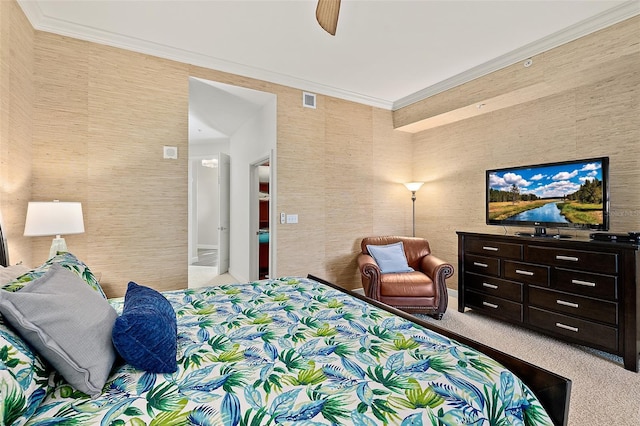 carpeted bedroom with a ceiling fan, visible vents, and crown molding