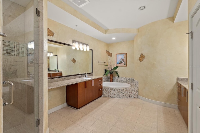 full bathroom featuring a garden tub, visible vents, baseboards, vanity, and a shower stall