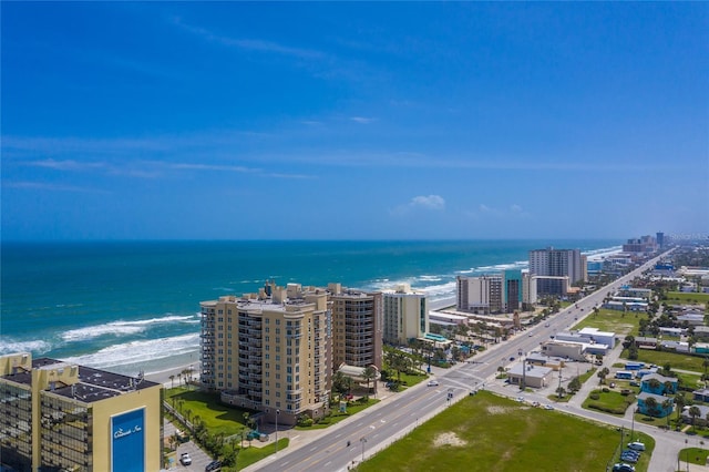 drone / aerial view featuring a water view and a city view