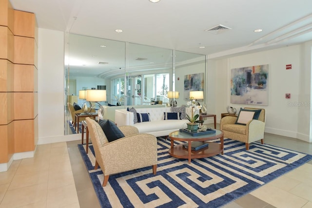 living room with recessed lighting, visible vents, and light tile patterned floors