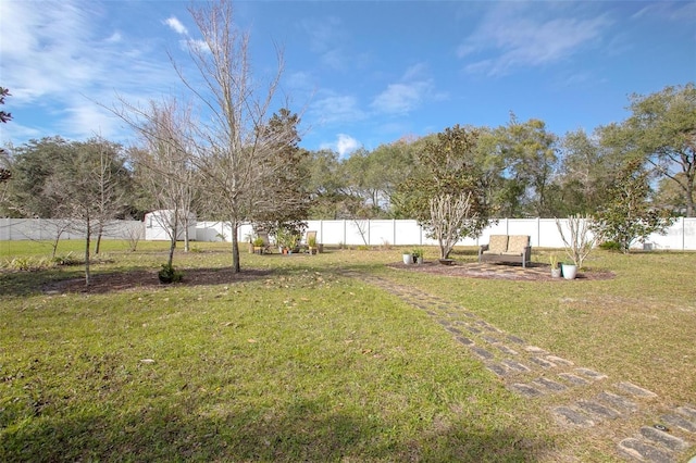 view of yard with a fenced backyard