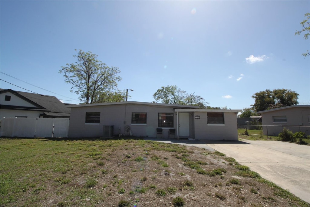 single story home featuring fence, central AC, and a front yard