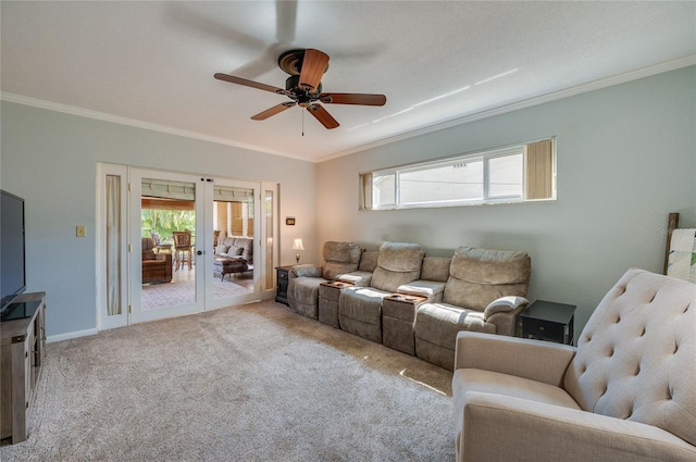 carpeted living room featuring french doors, ornamental molding, a ceiling fan, and baseboards