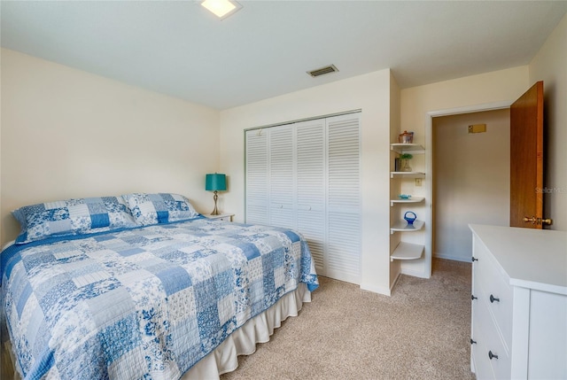 bedroom featuring a closet, visible vents, light carpet, and baseboards