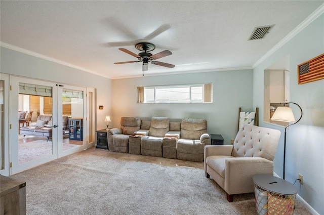 carpeted living room with french doors, visible vents, crown molding, and ceiling fan