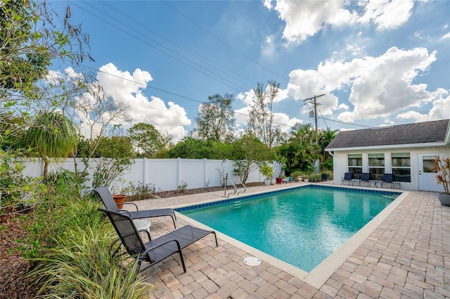 view of pool with a patio, a fenced backyard, and a fenced in pool