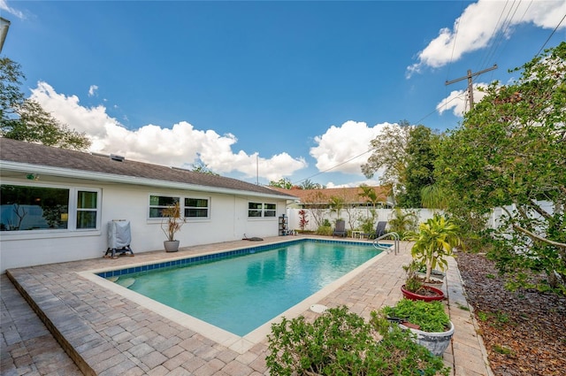 view of pool with a patio, a fenced backyard, and a fenced in pool