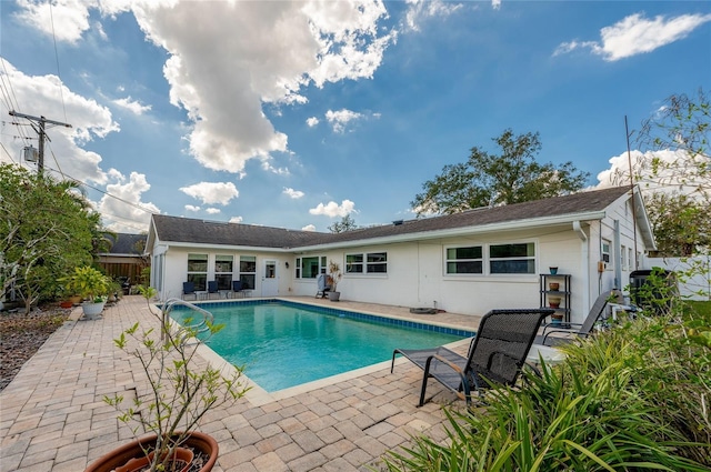 view of pool with a fenced in pool and a patio