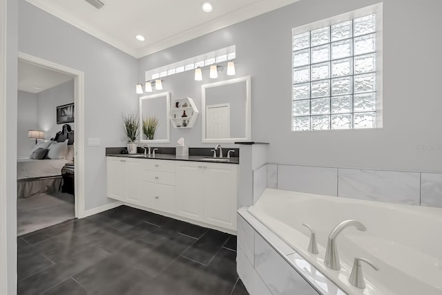 bathroom featuring a garden tub, double vanity, a sink, and crown molding