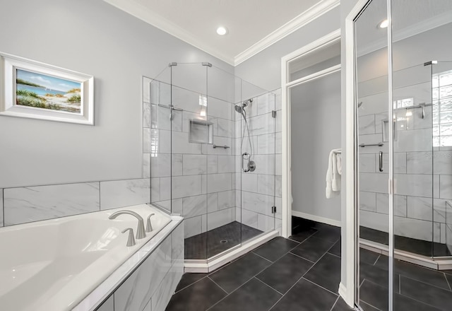 bathroom featuring a garden tub, crown molding, a shower stall, tile patterned flooring, and baseboards