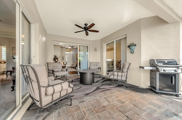 view of patio / terrace with ceiling fan and area for grilling