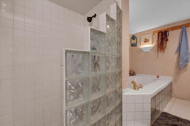 full bath with tile patterned floors, a garden tub, and walk in shower