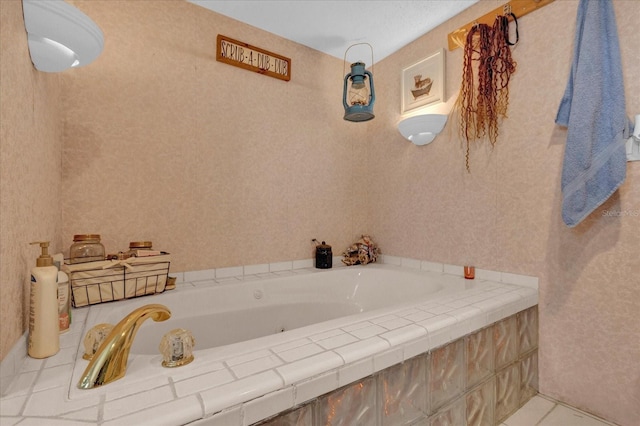 bathroom featuring wallpapered walls and a bath