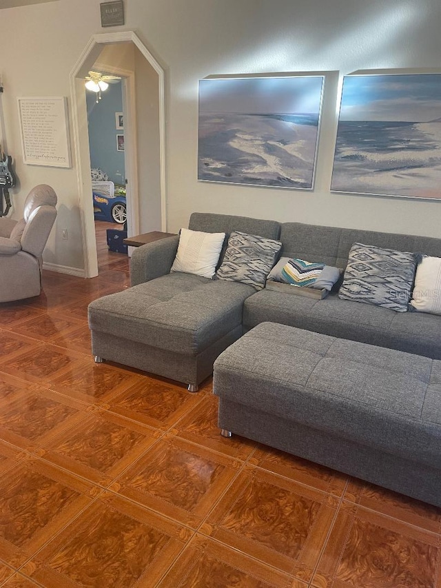 living area featuring baseboards