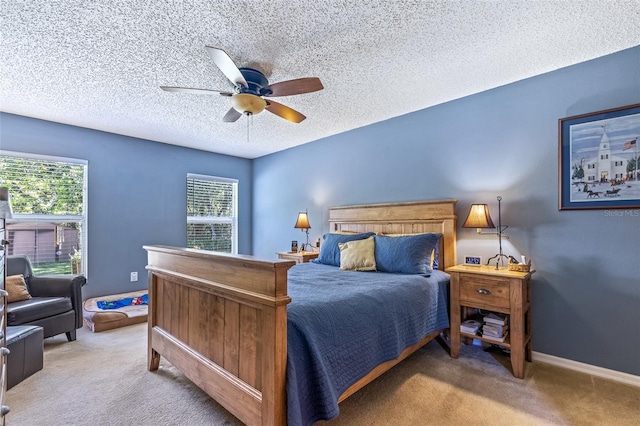 bedroom featuring carpet floors, ceiling fan, a textured ceiling, and baseboards