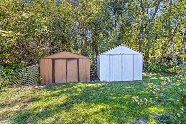 view of shed featuring fence