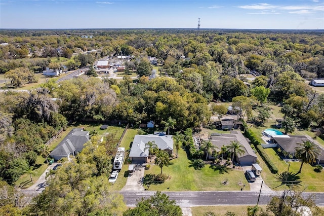 aerial view featuring a wooded view