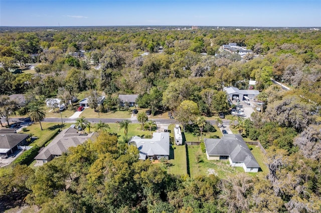 bird's eye view featuring a residential view and a view of trees