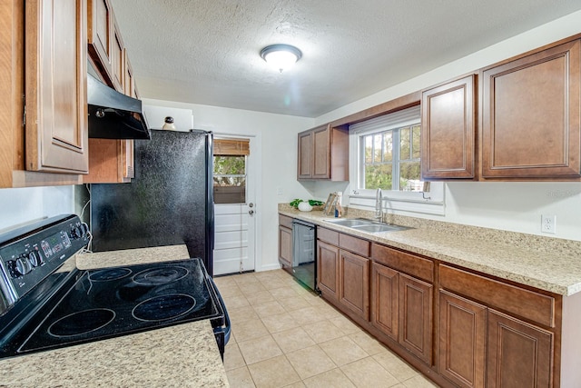 kitchen featuring a textured ceiling, under cabinet range hood, a sink, light countertops, and black appliances