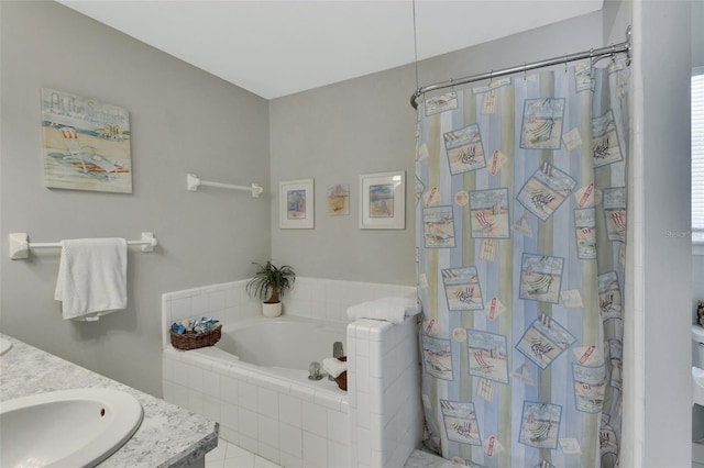 bathroom with curtained shower, a bath, and vanity