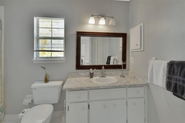 bathroom with toilet and vanity