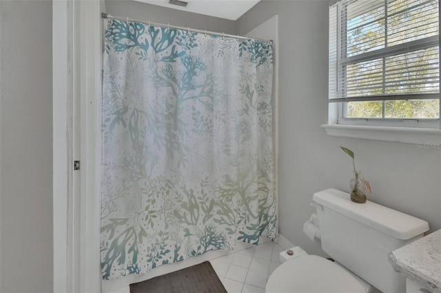 bathroom with a shower with curtain, visible vents, toilet, and tile patterned floors