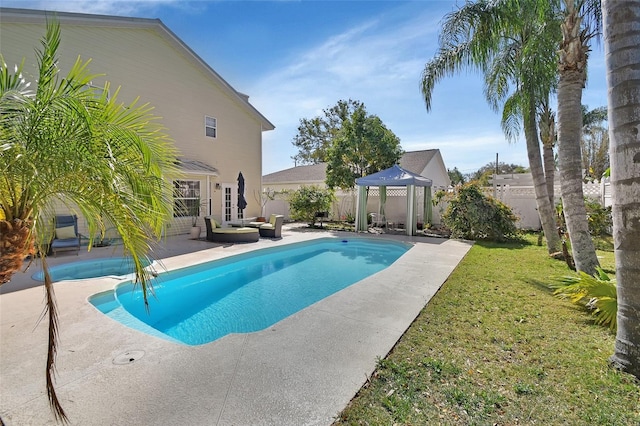 view of swimming pool featuring a fenced backyard, a yard, an outdoor living space, and a gazebo