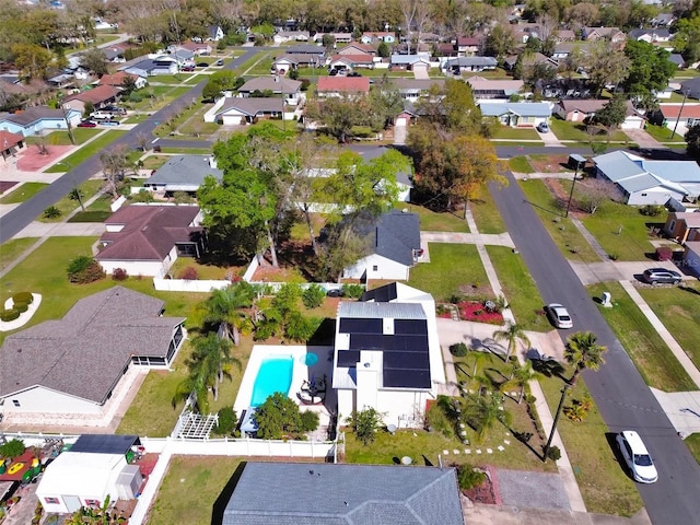 birds eye view of property with a residential view