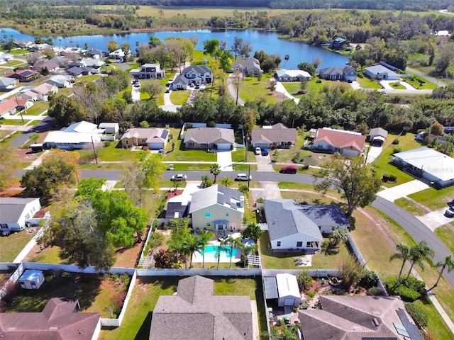 bird's eye view featuring a residential view and a water view