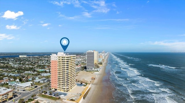 drone / aerial view with a view of the beach, a water view, and a view of city