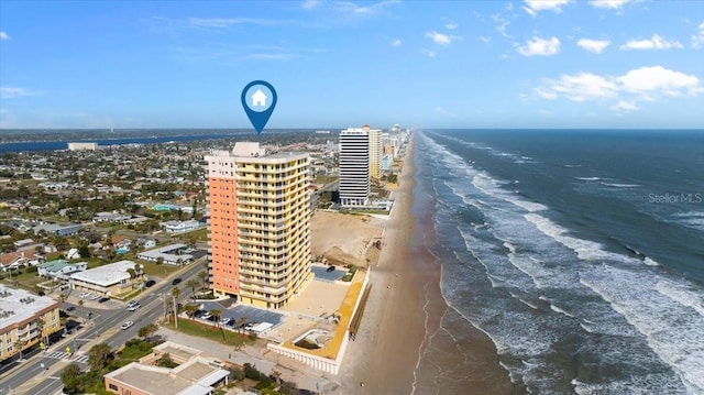 bird's eye view with a beach view, a water view, and a city view