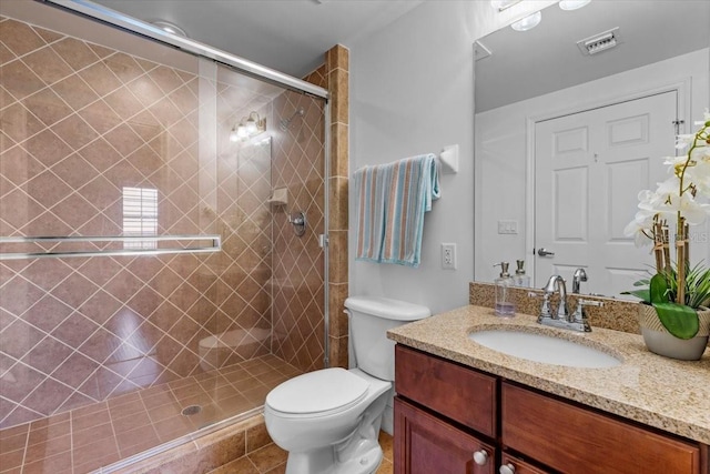 full bath featuring toilet, a stall shower, visible vents, and vanity