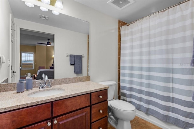 ensuite bathroom with visible vents, connected bathroom, vanity, and toilet