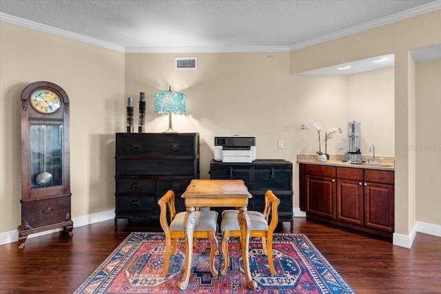 dining space with baseboards, crown molding, visible vents, and dark wood-style flooring