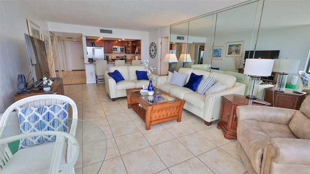 3051 S Atlantic Ave Unit 2206, Daytona Beach, FL 32118 - living area featuring visible vents and light tile patterned floors