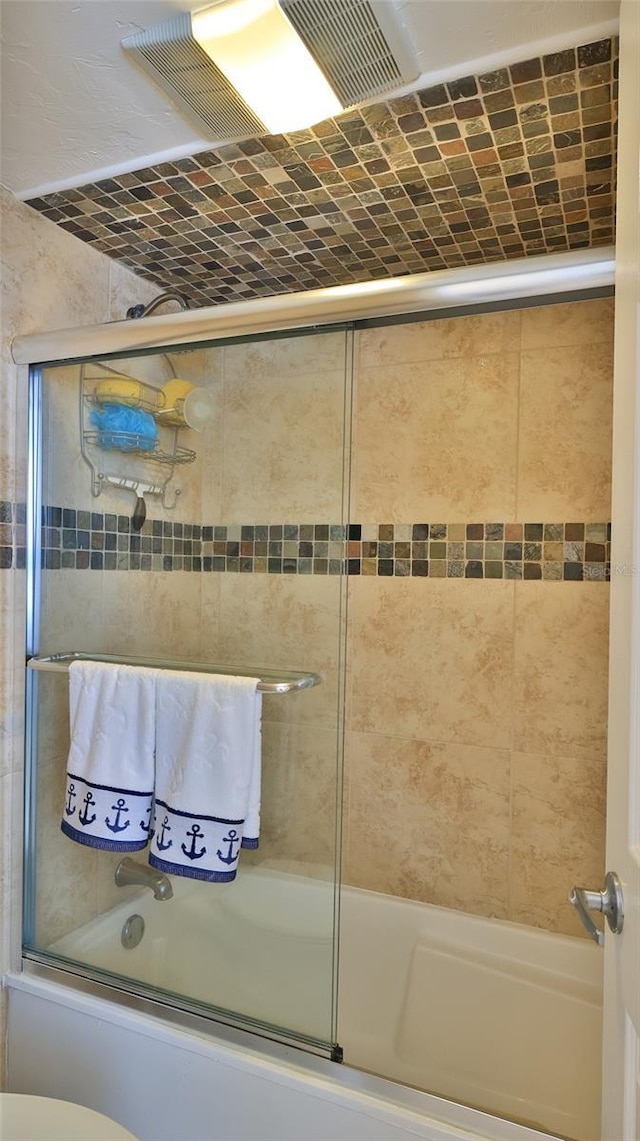 3051 S Atlantic Ave Unit 2206, Daytona Beach, FL 32118 - bathroom featuring shower / bath combination with glass door