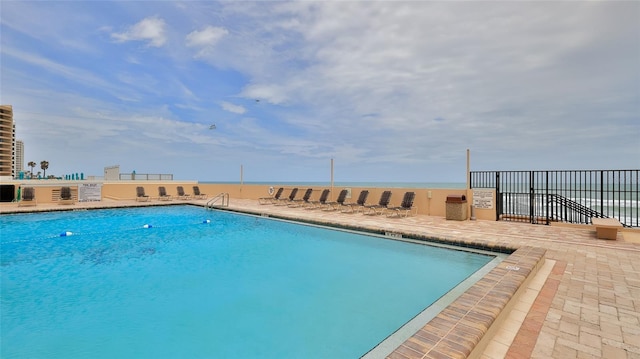 3051 S Atlantic Ave Unit 2206, Daytona Beach, FL 32118 - pool featuring a patio and fence