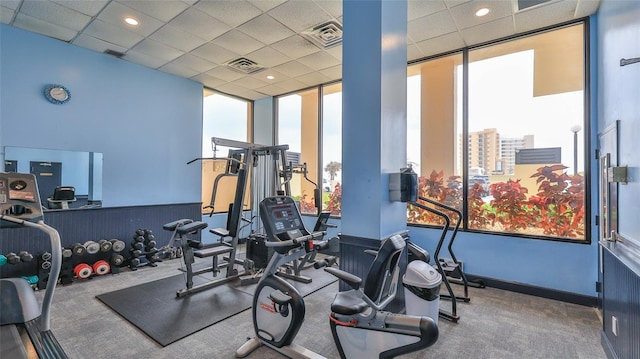 3051 S Atlantic Ave Unit 2206, Daytona Beach, FL 32118 - workout area featuring baseboards, visible vents, and a drop ceiling