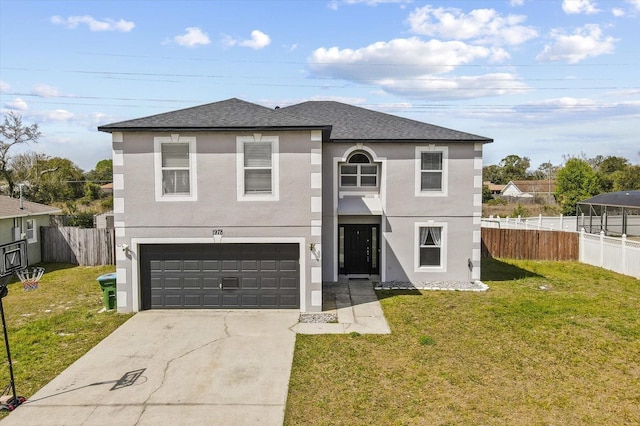 traditional home featuring stucco siding, driveway, a front yard, and fence