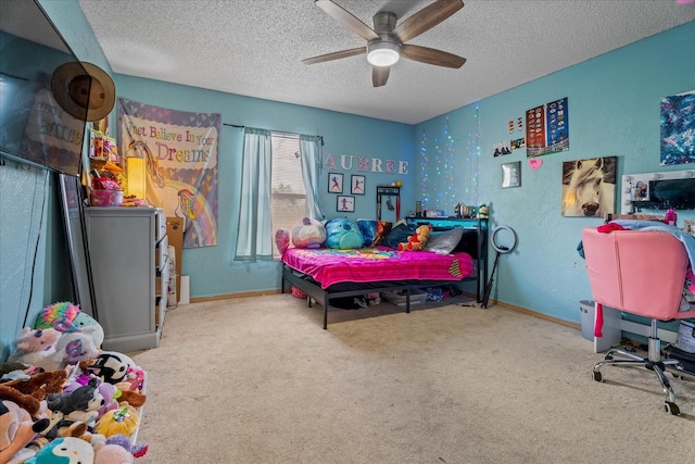 bedroom with carpet flooring, a textured wall, baseboards, and a textured ceiling