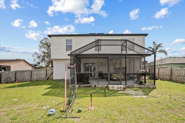 rear view of house featuring a patio area, a yard, a fenced backyard, and ceiling fan