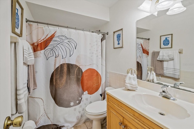 full bathroom featuring vanity, a shower with shower curtain, tile walls, toilet, and tile patterned floors